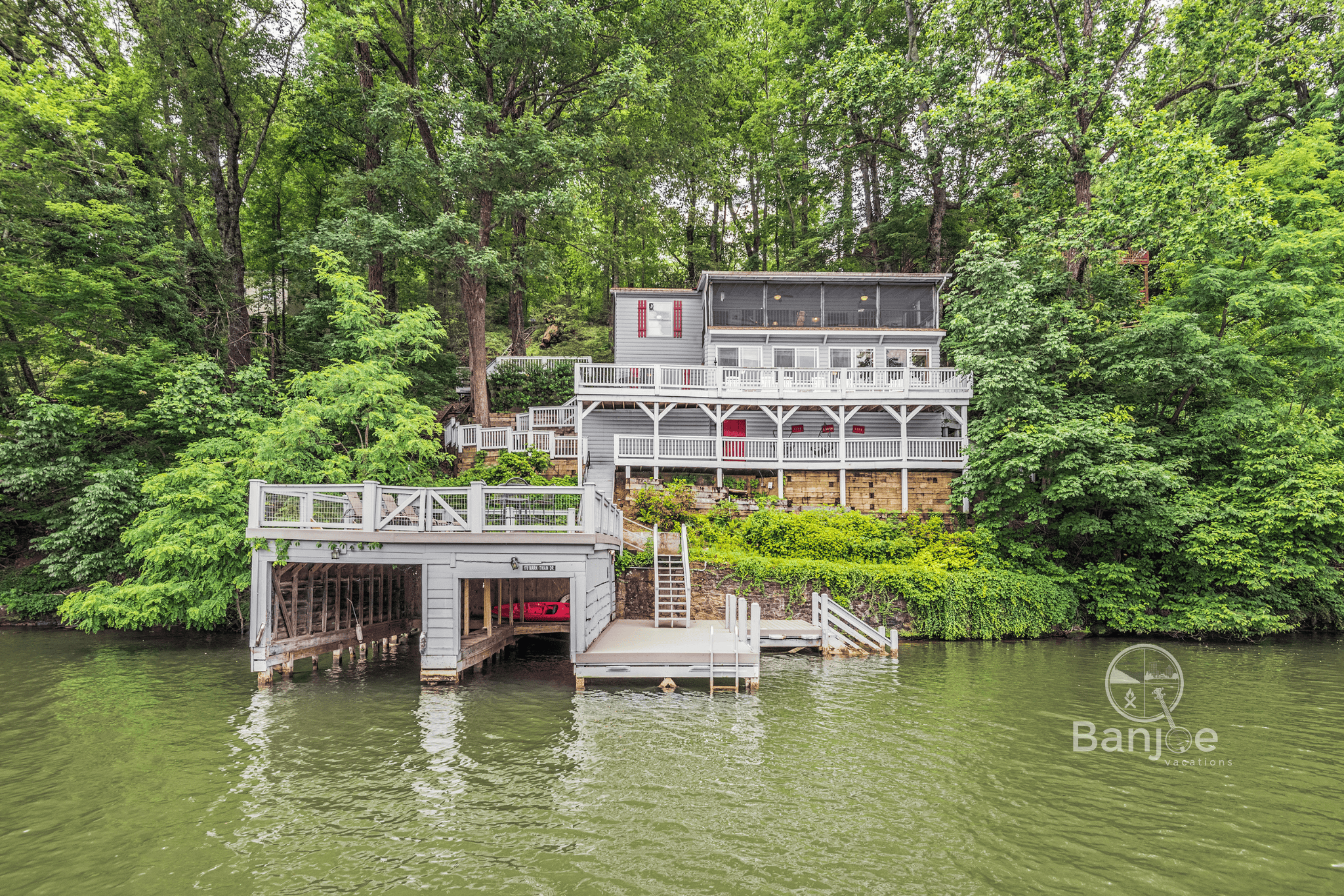 View of the Enchanted Cottage from the lake. (The boat house is currently under repair.)